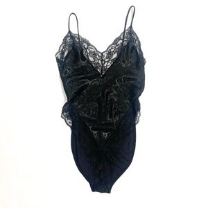 Vintage Lingerie. Black with lace trim and floral print on fabric.